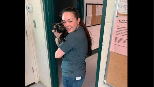 Mocha the cat with her owner.(Facebook/Tooele City Animal Shelter)