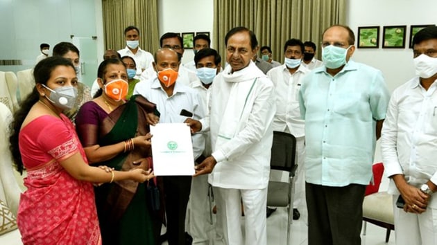 Telangana Chief Minister K Chandrashekhar Rao handing over the appointment letter to Santoshi in Hyderabad on Wednesday.(https://twitter.com/TelanganaCMO)