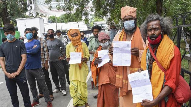 Sadhus wait in a queue to get tested for Coronavirus outside Gandhi Nagar hospital before the announcement of cancelling the annual Amarnath Yatra, which was scheduled to begin in Jammu on July 21, 2020.(PTI) Sadhus wait in a queue to get tested for Coronavirus outside Gandhi Nagar hospital before the announcement of cancelling the annual Amarnath Yatra, which was scheduled to begin in Jammu on July 21, 2020.(PTI)