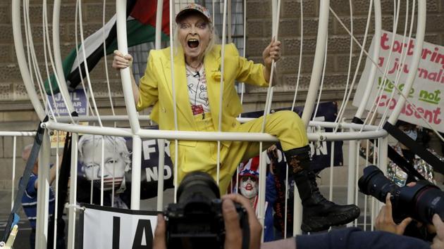 Fashion designer Vivienne Westwood stands in a giant bird cage in protest against the extradition of WikiLeaks founder Julian Assange to the U.S. (AP Photo/Matt Dunham) Fashion designer Vivienne Westwood stands in a giant bird cage in protest against the extradition of WikiLeaks founder Julian Assange to the U.S. (AP Photo/Matt Dunham)