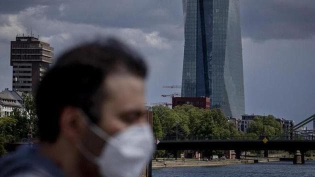 A man walks in front of the European Central Bank in Frankfurt, Germany. (AP file photo) A man walks in front of the European Central Bank in Frankfurt, Germany. (AP file photo)