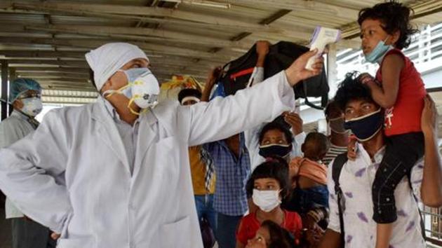 Migrants undergo thermal screening .(PTI file photo) Migrants undergo thermal screening .(PTI file photo)