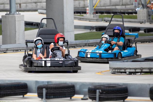 People ride go karts at a tourist attraction in Niagara Falls, Ontario, Canada July 21, 2020. (REUTERS) People ride go karts at a tourist attraction in Niagara Falls, Ontario, Canada July 21, 2020. (REUTERS)
