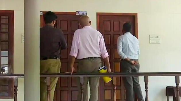 A three-member team of Customs officials at the residence of M Sivasankar (former principal secretary to the Chief Minister and IT secretary) to serve him a notice to appear for questioning in connection with the ongoing probe in the gold smuggling case earlier this month.(ANI PHOTO.)