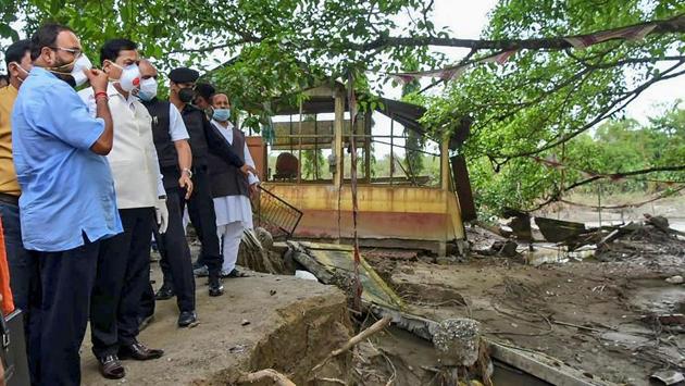 Assam Chief Minister Sarbananda Sonowal inspects the Pahumara River embankment which was breached due to floods at Gahinpara in Barpeta district on July 20. The Chief Minister visited multiple erosion hit and flooded areas this week and assessed the devastations caused by flooding rivers. (PTI)