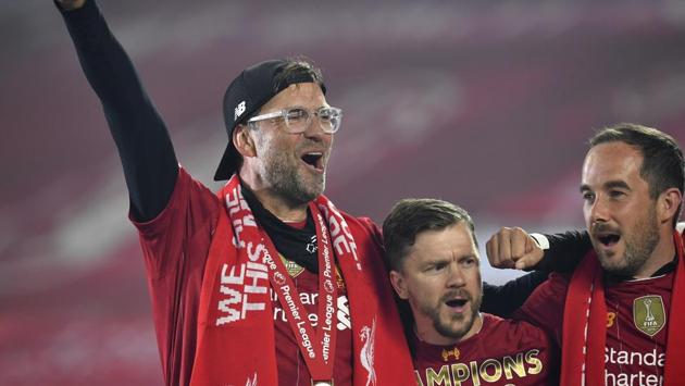 Liverpool's manager Jurgen Klopp, left, celebrates following the English Premier League soccer match between Liverpool and Chelsea at Anfield Stadium. (AP)