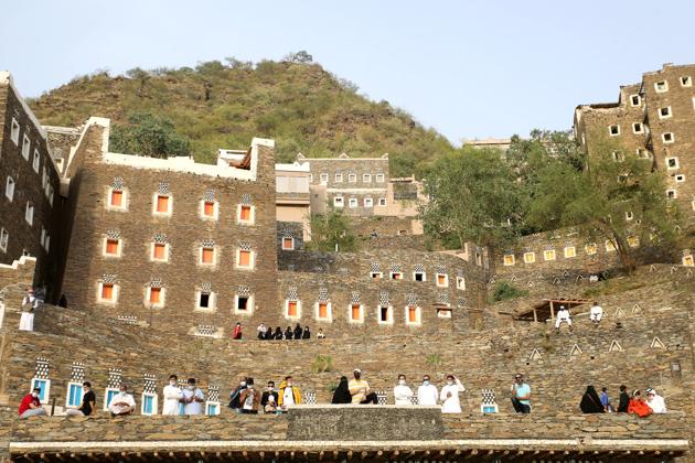 A general view shows tourists at the cultural village of Rijal Almaa in the outskirts of Abha, Saudi Arabia July 17, 2020. (REUTERS) A general view shows tourists at the cultural village of Rijal Almaa in the outskirts of Abha, Saudi Arabia July 17, 2020. (REUTERS)