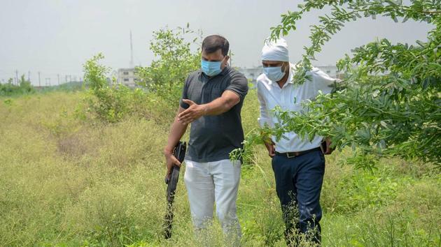 STF and Forensic teams re-enact the events leading to the encounter of slain gangster Vikas Dubey, as part of ongoing investigation of the case, in Kanpur district. (PTI) STF and Forensic teams re-enact the events leading to the encounter of slain gangster Vikas Dubey, as part of ongoing investigation of the case, in Kanpur district. (PTI)
