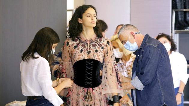 A model takes part in a fitting ahead of Dior's 2021 Cruise collection presentation by designer Maria Grazia Chiuri at Dior fashion house in Paris, France. (REUTERS/Charles Platiau) A model takes part in a fitting ahead of Dior's 2021 Cruise collection presentation by designer Maria Grazia Chiuri at Dior fashion house in Paris, France. (REUTERS/Charles Platiau)