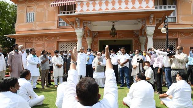 Upon reaching, CM Gehlot headed straight to meet governor Kalraj Mishra, while the lawmakers were seen sitting under the sun in the Raj Bhawan garden. (HT Photo)