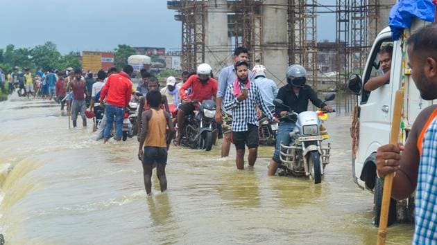Vehicles ply on the flooded NH-28A following heavy monsoon rain at Raxual in East Champaran on July 22. The most affected districts are in the catchment areas along the Nepal border. These include West Champaran, East Champaran, Sitamarhi, Sheohar, Supaul, Kishanganj, Darbhanga, Muzaffarpur, Khagaria and Gopalganj. (PTI) Vehicles ply on the flooded NH-28A following heavy monsoon rain at Raxual in East Champaran on July 22. The most affected districts are in the catchment areas along the Nepal border. These include West Champaran, East Champaran, Sitamarhi, Sheohar, Supaul, Kishanganj, Darbhanga, Muzaffarpur, Khagaria and Gopalganj. (PTI)