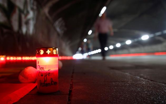 A candle is pictured at the "Night of Lights" event to commemorate the victims of a deadly stampede during the 2010 Love Parade festival, at the former festival site on the eve of the disaster's 10th anniversary, in Duisburg, Germany, July 23, 2020. (REUTERS) A candle is pictured at the "Night of Lights" event to commemorate the victims of a deadly stampede during the 2010 Love Parade festival, at the former festival site on the eve of the disaster's 10th anniversary, in Duisburg, Germany, July 23, 2020. (REUTERS)