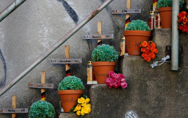 Crosses and flower pots with names of the victims are seen at a memorial at the "Night of Lights" event to commemorate the victims of a deadly stampede during the 2010 Love Parade festival, at the former festival site on the eve of the disaster's 10th anniversary, in Duisburg, Germany, July 23, 2020. (REUTERS) Crosses and flower pots with names of the victims are seen at a memorial at the "Night of Lights" event to commemorate the victims of a deadly stampede during the 2010 Love Parade festival, at the former festival site on the eve of the disaster's 10th anniversary, in Duisburg, Germany, July 23, 2020. (REUTERS)