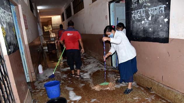 On Thursday, Yashwantrao Chavan Primary and Secondary School, Thergaon was cleaned and preparations are underway to convert it into a Covid-19 care centre.(HT PHOTO)