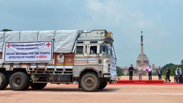 President Ram Nath Kovind flags off trucks carrying Red Cross Relief Material for people affected by flood and COVID-19 in Bihar at Rashtrapati Bhawan in New Delhi on July 24. The relief material included items such as tarpaulins, tents, saris, dhotis, cotton blankets, kitchen sets, mosquito nets, bed sheets, buckets, two water purification units and Covid-19 relief items, a government official told PTI. (ANI) President Ram Nath Kovind flags off trucks carrying Red Cross Relief Material for people affected by flood and COVID-19 in Bihar at Rashtrapati Bhawan in New Delhi on July 24. The relief material included items such as tarpaulins, tents, saris, dhotis, cotton blankets, kitchen sets, mosquito nets, bed sheets, buckets, two water purification units and Covid-19 relief items, a government official told PTI. (ANI)