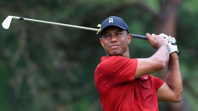 Tiger Woods plays his shot (USA TODAY Sports)