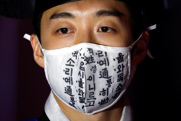 A model wears a mask during a fashion show as a measure to avoid the spread of the coronavirus disease (COVID-19), in Seoul, South Korea July 24, 2020. (REUTERS)