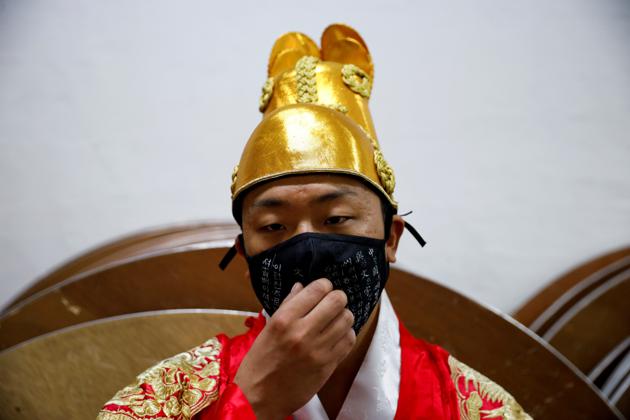 A model is seen before a fashion show wearing a mask, as a measure to avoid the spread of the coronavirus disease (COVID-19), in Seoul, South Korea July 24, 2020. (REUTERS)