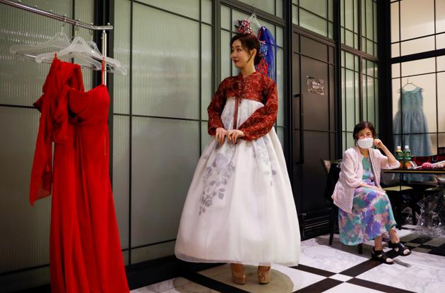 A model is seen before a fashion show during which models will be wearing masks, as a measure to avoid the spread of the coronavirus disease (COVID-19), in Seoul, South Korea July 24, 2020. (REUTERS)