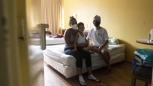 An asymptomatic COVID-19 family sits in the hotel room where they are quarantining in Caracas, Venezuela, Friday, July 24, 2020. (Representational image)(AP)