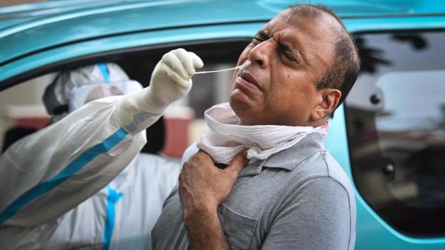 A health worker collects a swab sample from a man to test for Covid-19 infection in New Delhi on July 23. According to the Union Ministry’s status report, the tally of India’s coronavirus cases went up by 48,661 on July 26 with 705 coronavirus deaths also being added in the last 24 hours taking the death toll to 32,063. (Sanchit Khanna / HT Photo) A health worker collects a swab sample from a man to test for Covid-19 infection in New Delhi on July 23. According to the Union Ministry’s status report, the tally of India’s coronavirus cases went up by 48,661 on July 26 with 705 coronavirus deaths also being added in the last 24 hours taking the death toll to 32,063. (Sanchit Khanna / HT Photo)