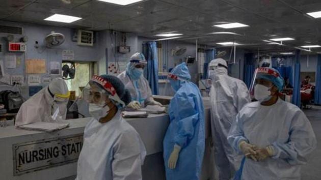 Medical workers wearing personal protective equipment (PPE) are seen inside an Intensive Care Unit (ICU) for patients suffering from the coronavirus disease.(REUTERS)