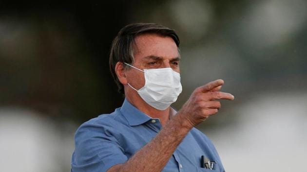 Brazil's President Jair Bolsonaro gestures before a ceremony of lowering the national flag for the night, amid the coronavirus disease outbreak, at the Alvorada Palace in Brasilia, Brazil.(REUTERS) Brazil's President Jair Bolsonaro gestures before a ceremony of lowering the national flag for the night, amid the coronavirus disease outbreak, at the Alvorada Palace in Brasilia, Brazil.(REUTERS)