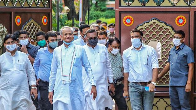 Rajasthan Chief Minister Ashok Gehlot along with senior Congress leaders and MLAs arrives to address media outside Raj Bhawan, in Jaipur.(PTI)