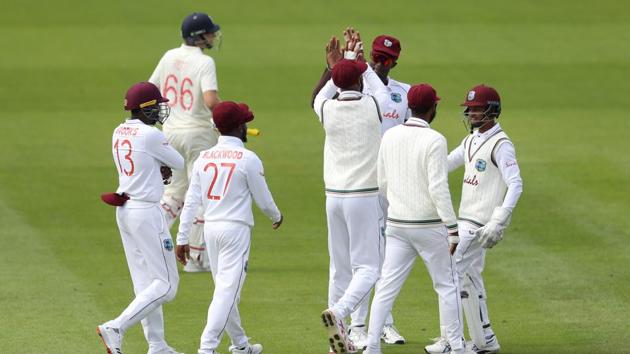 West Indies' Roston Chase celebrates running out England's Joe Root with teammates. (REUTERS)