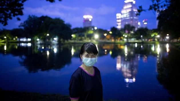 Nantaga Sanguannoi, who works as a nurse, poses for a photo in Bangkok, Thailand on July 21. “I want everyone to know it is easy to prevent spreading of COVID-19 by wearing a mask. Lot of resources have been utilized, and economies have been shattered because of the virus. If we can prevent spreading of the virus those resources can be utilized to help already affected poor people, think about it,” Sanguannoi said to the AP. (Gemunu Amarasinghe / AP) Nantaga Sanguannoi, who works as a nurse, poses for a photo in Bangkok, Thailand on July 21. “I want everyone to know it is easy to prevent spreading of COVID-19 by wearing a mask. Lot of resources have been utilized, and economies have been shattered because of the virus. If we can prevent spreading of the virus those resources can be utilized to help already affected poor people, think about it,” Sanguannoi said to the AP. (Gemunu Amarasinghe / AP)