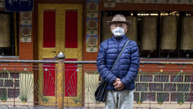 Kalsang Chokteng, an in-exile Tibetan, poses for a photograph in Dharamsala, India on July 21. Kalsang told the AP that people who do not want to wear masks are selfish and should think of the impact of their careless action on others. (Ashwini Bhatia / AP) Kalsang Chokteng, an in-exile Tibetan, poses for a photograph in Dharamsala, India on July 21. Kalsang told the AP that people who do not want to wear masks are selfish and should think of the impact of their careless action on others. (Ashwini Bhatia / AP)