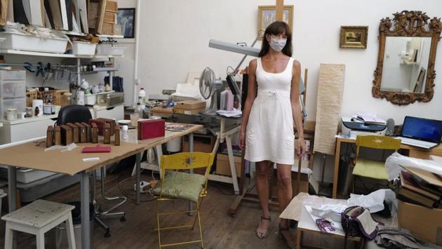 Emmanuelle Prevot, a restorer of paintings and artwork poses in her workshop in Paris on July 21. Emmanuelle said that she does not wear a mask always while working with chemicals for paintings because it impedes work, but said that she accepts wearing masks in public areas to not worry people, although she does not stress on it. (Francois Mori / AP) Emmanuelle Prevot, a restorer of paintings and artwork poses in her workshop in Paris on July 21. Emmanuelle said that she does not wear a mask always while working with chemicals for paintings because it impedes work, but said that she accepts wearing masks in public areas to not worry people, although she does not stress on it. (Francois Mori / AP)