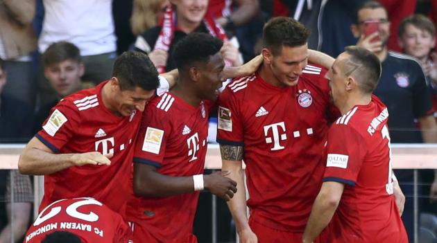 Bayern defender Niklas Suele, center right, celebrates with teammates(AP) Bayern defender Niklas Suele, center right, celebrates with teammates(AP)