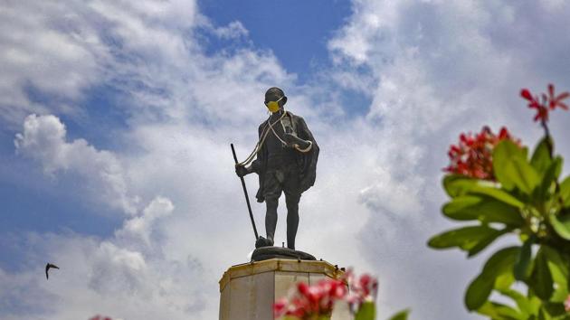 A mask is placed on a statue of Mahatma Gandhi to spread awareness against coronavirus, during the ongoing Covid-19 lockdown, at Gandhi Circle in Jaipur.(PTI)