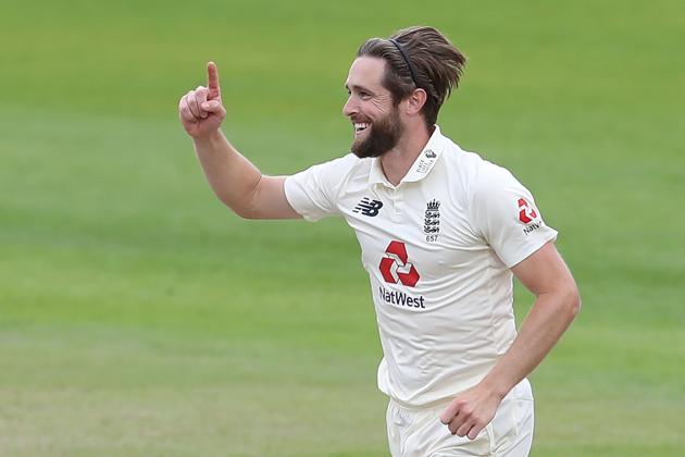 England's Chris Woakes celebrates taking the wicket of West Indies' Jermaine Blackwood for 26 on the second day of the third Test cricket match between England and the West Indies at Old Trafford in Manchester, northwest England on July 25, 2020. (Photo by Martin Rickett / POOL / AFP) / RESTRICTED TO EDITORIAL USE. NO ASSOCIATION WITH DIRECT COMPETITOR OF SPONSOR, PARTNER, OR SUPPLIER OF THE ECB (AFP)