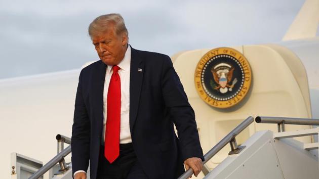 President Donald Trump steps off Air Force One at Morristown Municipal Airport in Morristown. (AP) President Donald Trump steps off Air Force One at Morristown Municipal Airport in Morristown. (AP)