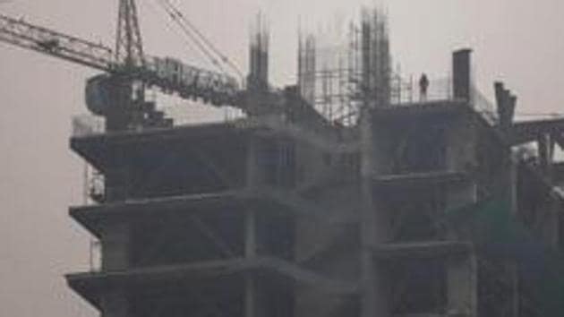 The complainant had booked a flat in a Noida housing project on August 7, 2011. The total cost of the flat was Rs 55.97 lakh, and the complainant said she had paid Rs 48.08 lakh to the developer till the filing of the complaint. (Bloomberg file photo. Representative image) The complainant had booked a flat in a Noida housing project on August 7, 2011. The total cost of the flat was Rs 55.97 lakh, and the complainant said she had paid Rs 48.08 lakh to the developer till the filing of the complaint. (Bloomberg file photo. Representative image)