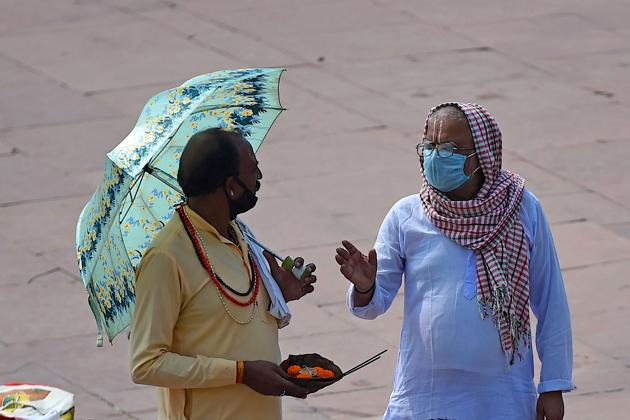 Hindu priests talk at Har Ki Pauri Ghat on the banks of the river Ganges, after the government eased a nationwide lockdown imposed as a preventive measure against the Covid-19 coronavirus at Haridwar in Uttarakhand. (AFP) Hindu priests talk at Har Ki Pauri Ghat on the banks of the river Ganges, after the government eased a nationwide lockdown imposed as a preventive measure against the Covid-19 coronavirus at Haridwar in Uttarakhand. (AFP)