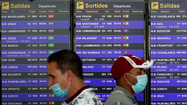 Travellers at Josep Tarradellas Barcelona-El Prat airport on July 26. Norway on July 24 had announced a 10-day quarantine for people returning from Spain, and France issued travel warnings for the Catalonia region, which is home to Barcelona and popular beaches. The moves will further weigh on bookings in the peak travel period for a country dependent on tourism for around 10% of gross domestic product, according to Bloomberg. (Albert Gea / REUTERS) 