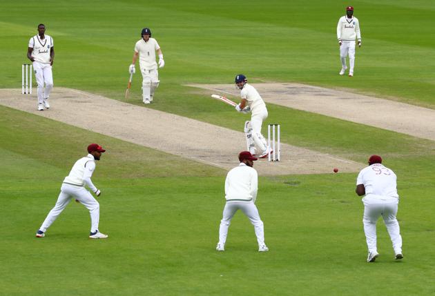 Cricket - Third Test - England v West Indies - Emirates Old Trafford, Manchester, Britain - July 25, 2020 England's James Anderson is caught out by West Indies' Rahkeem Cornwall bowled by Jason Holder, as play resumes behind closed doors following the outbreak of the coronavirus disease (COVID-19) Michael Steele/Pool via REUTERS (REUTERS)