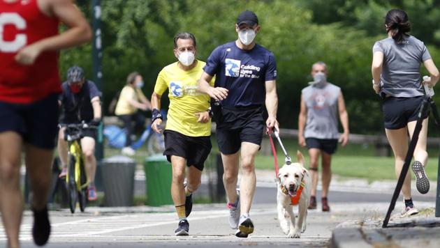 Fitness amid Covid 19 Guide dogs help blind runners stay healthy