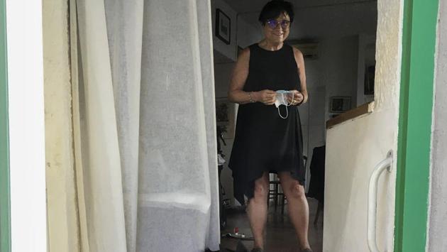 Italian scientist Paola Muti poses after an interview in her home at the Giglio Island, Italy, Tuesday, June 23, 2020. (AP Photo/Paolo Santalucia)