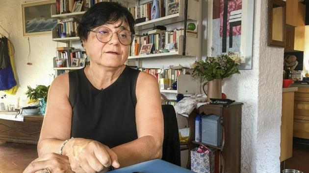 Italian scientist Paola Muti talks with the Associated Press during an interview in his studio at the Giglio Island, Italy, Tuesday, June 23, 2020. (AP Photo/Paolo Santalucia)