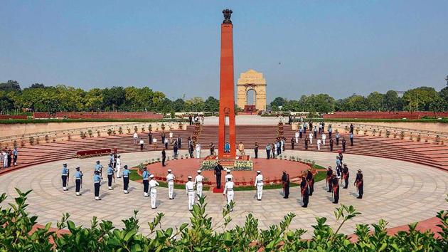 On Kargil Vijay Diwas, defence minister Rajnath Singh and military chiefs pay tributes to martyrs of the Kargil war at the National War Memorial in New Delhi on Sunday. (PTI) On Kargil Vijay Diwas, defence minister Rajnath Singh and military chiefs pay tributes to martyrs of the Kargil war at the National War Memorial in New Delhi on Sunday. (PTI)
