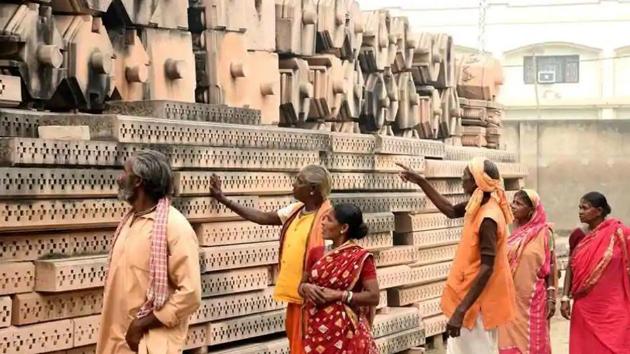 People take a look at the stones which are for the making of Ram Temple in Ayodhya. (ANI Photo ) People take a look at the stones which are for the making of Ram Temple in Ayodhya. (ANI Photo )