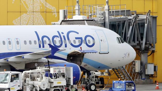 An aircraft operated by IndiGo, a unit of InterGlobe Aviation Ltd., stands at Terminal 3 of Indira Gandhi International Airport in New Delhi.(Bloomberg)