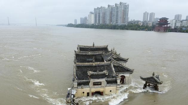 The Kwanyin temple built on a rocky island in the middle of the Yangtze River is seen flooded as the water level surge along Ezhou in central China's Hubei province on Sunday, July 19, 2020.(AP)