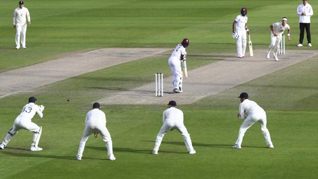England's Jos Buttler, left, prepares to take the catch to dismiss West Indies' Kemar Roach, center, during the third day of the third cricket Test match. (AP)