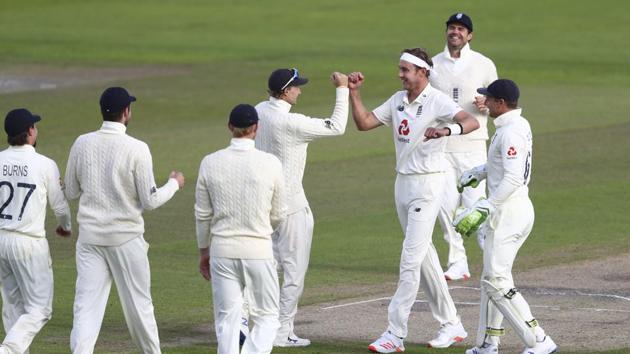 England's Stuart Broad, third right, celebrates with teammates the dismissal of West Indies' John Campbell. (AP)