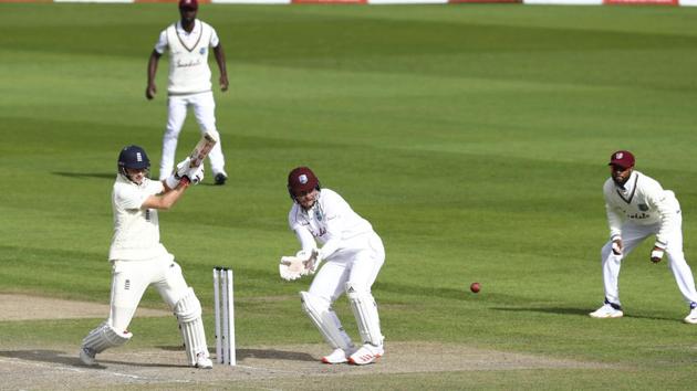 England's captain Joe Root, left, bats during the third day of the third cricket Test match between England and West Indies. (AP)